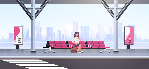 Wall Mural - businesswoman sitting modern bus stop business woman with suitcase waiting public transport on airport station cityscape background flat horizontal full length