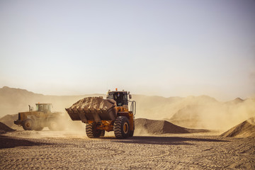 Wall Mural - Bulldozers and earthmovers working in quarries