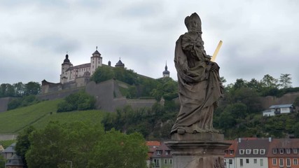 Wall Mural - WURZBURG, GERMANY - JUNE 12, 2019: The statue of St Kilian in a the alte Mainbrucke, the old bridge across the Main river in Wurzburg - Bavaria, Germany