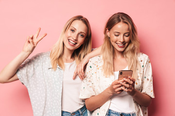 Poster - Two attractive blonde girls wearing summer outfit