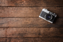 Old Photo Camera On Wooden Background