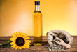 Sunflower oil in a bottle and sunflower seeds and sunflower