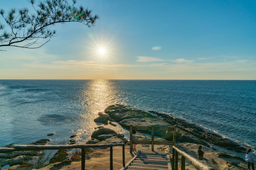 Wall Mural - the Tip of Borneo as sun drops to horizon.