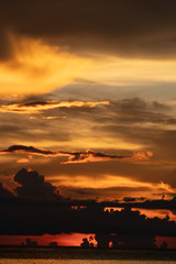 Sticker - Beautiful vertical composition colorful sky at sunset vivid colors over ocean to horizon in Sabah Borneo.