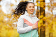 © Syda Productions - fitness, sport, people and healthy lifestyle concept - young woman running in autumn park