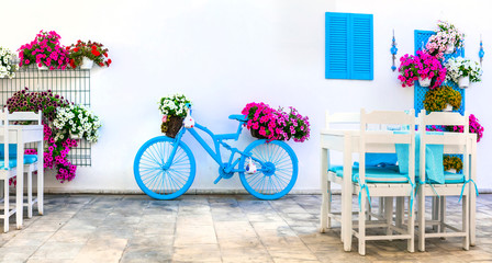 Wall Mural - Charming street (outdoor) decoration with old bicycle and flowers. Bodrum, Turkey