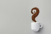 White Ceramic Cup Of Coffee With Curly Steam Made From Grounds On Gray. Creative Food Artwork. Breakfast Energy Concept. Design Element Template For Social Media Cafes Restaurants Bars
