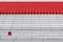 Rows Of Red Seats In Empty Stadium. Concept Of Emptiness. Individuality. Standing Out In The Crowd. Abstract Minimal Background.