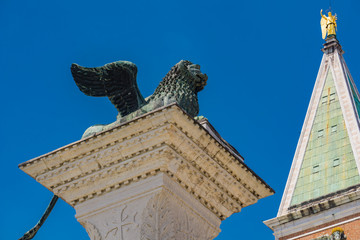 Wall Mural - Sculpture depicting image of lion with wings, symbol of Venice, on the top of the column at San Marco, Italy