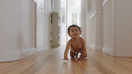 happy baby girl crawling on floor toddler exploring home curious infant having fun enjoying childhood