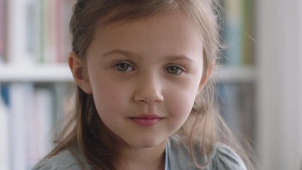 portrait beautiful little girl smiling with natural childhood curiosity looking joyful child with in