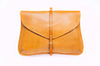 Woman yellow purse isolated on the white background. Closeup of modern yellow leather wallet over white background. Top view on the wallet.