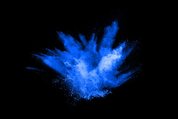 abstract blue powder splatted background,Freeze motion of color powder exploding/throwing color powder,color glitter texture on black background.