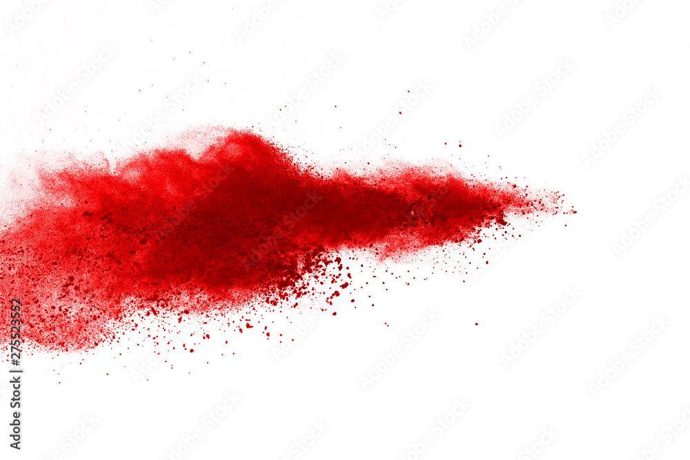 Freeze motion of red powder exploding, isolated on white background ...