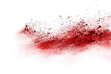 Wall Mural - freeze motion of red powder exploding, isolated on white background. abstract design of red dust clo