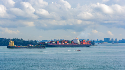 Wall Mural - Navigation in the Straits of Singapore is highly congested by merchant traffic, coasters, fishing vessels and local traffic.