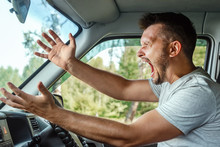 Aggressive Man, The Driver Of The Car Is Outraged At The Wheel During The Trip. Emergency, Accident, Violation Of Rights, Dispute, Bad Driver
