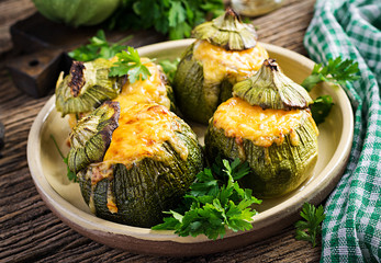 Wall Mural - Zucchini stuffed with minced meat, cheese and green herbs. Baked in oven. Top vie