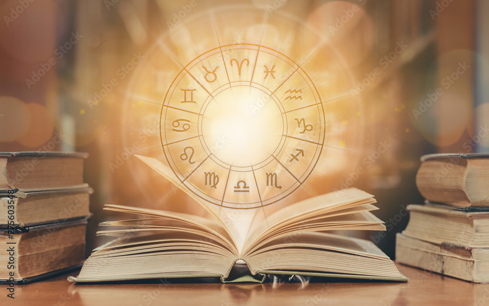 Zodiac sign horoscope astrology and constellation study for foretell and fortune telling education course concept with horoscopic wheel over old book in school library - obrazy, fototapety, plakaty 