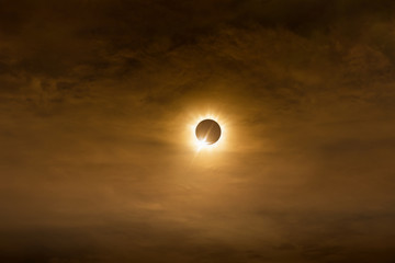 Poster - Total solar eclipse in dark red cloudy sky