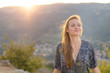 © PhotoGranary - Young woman portrait. Young woman with sexy dress at sunset. Rhone valley in the background.