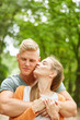 © Robert Kneschke - Young woman kisses her partner