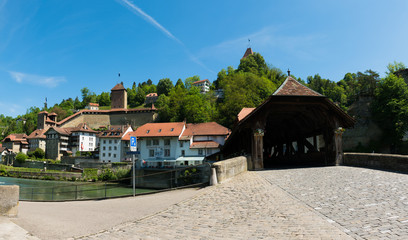 Wall Mural - view of the historic Place de Jean-Francois-Reyff Square and Bernbruecke covered bridge in the old town of the Swiss city of Fribourg