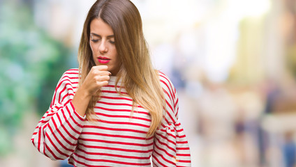 Poster - Young beautiful woman casual stripes winter sweater over isolated background feeling unwell and coughing as symptom for cold or bronchitis. Healthcare concept.