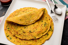 Chilla Or Besan Cheela Is A Simple Pancake Made With Chickpea Flour And Some Basic Ingredients Served With Green Chutney And Tomato Sauce, Also Known As Veg-omelette