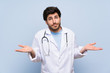 © luismolinero - Doctor man having doubts with confuse face expression