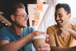 © BullRun - Excited Caucasian hipster guys feeling great during friendly meeting in cafeteria interior for communication during break indoors, happy cheerful male teenagers laughing and enjoying time for coffee