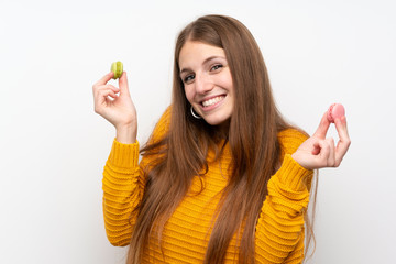 Wall Mural - Young woman with long hair with macaroons