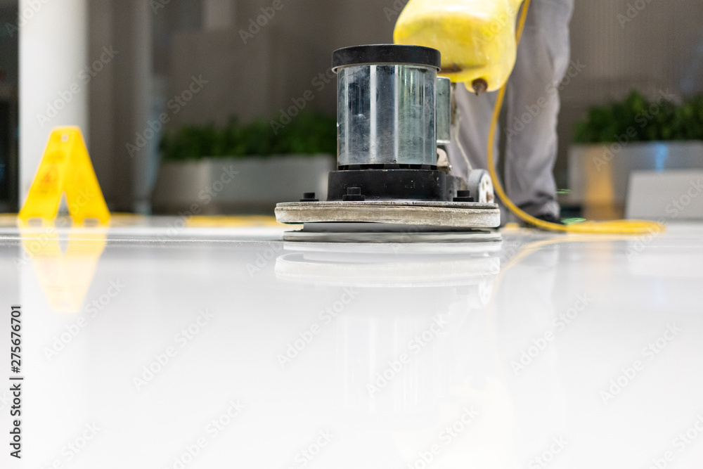 cleaning floor with machine