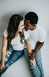 © MeganBetteridge - Happy Biracial Couple in Modern White Room
