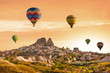 © Kotangens - Colorful hot air balloons flying over the valley at Cappadocia, Uchisar, Turkey. Volcanic mountains in Goreme national park