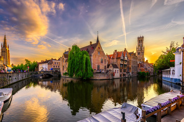 Wall Mural - Classic view of the historic city center of Bruges (Brugge), West Flanders province, Belgium. Sunset cityscape of Bruges. Canals of Brugge