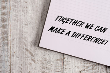 Conceptual hand writing showing Together We Can Make A Difference. Concept meaning be very important some way in like team or group Notebook stationary placed above classic wooden backdrop