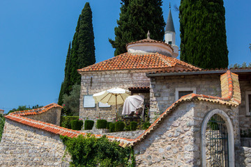 Wall Mural - View of beautiful stone house with tiled roof in old town of Bar, Montenegro