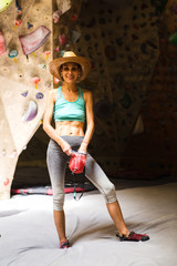 Sticker - Slender rock climber holds a chalk bag.