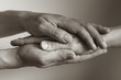 © kieferpix - Hand holding another hand. People helping and comforting each other concept.