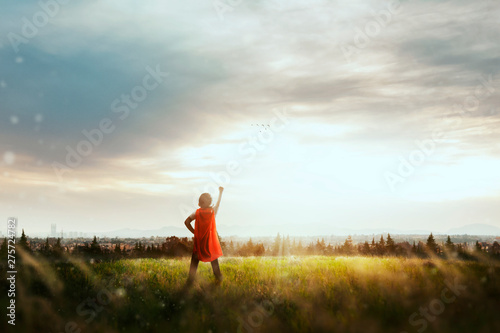 Fotomural boy with cape playing to be super hero