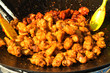 © MyungJin - Deep-fried chicken in cauldron.