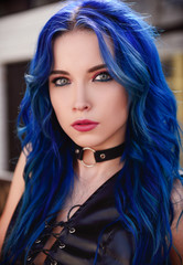 Closeup portrait of beautiful young girl (informal model) with blue hair