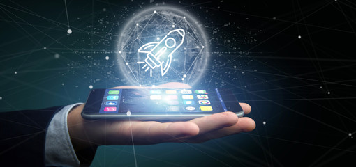 Poster - businessman holding a start up rocket on a sphere 3d rendering