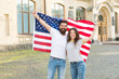 © be free - Our national identity is american. American citizens celebrating national sovereignty. Bearded man and sexy girl holding national flag of USA. The American flag is the symbol of our national pride