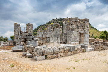 Ancient city of Kaunos, Dalyan valley, Turkey. Kaunos (Latin: Caunus) was a city of ancient Caria and in Anatolia, a few km west of the modern town of Dalyan, Muğla Province, Turkey.