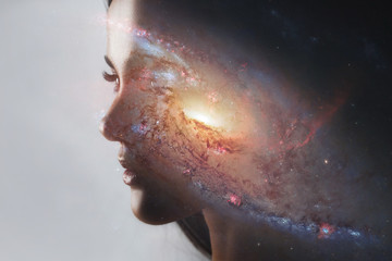 the universe inside us, the profile of a young woman and space, the effect of double exposure. scien
