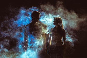 The silhouette of couple in the smoke