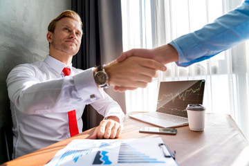 successful business meeting caucasian businessman manager white shirt red tie enjoy with result of profit from chart graph with co worker office background