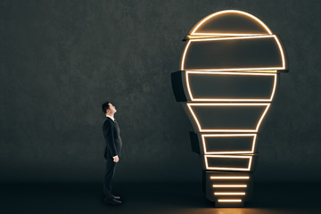 Poster - Businessman looking at lamp